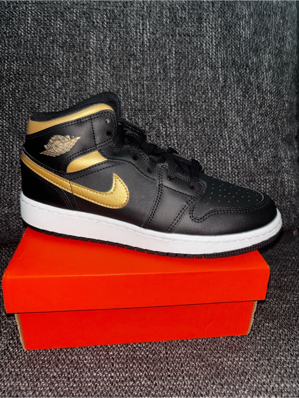 Jordan Black and Gold Mid-Top Sneaker